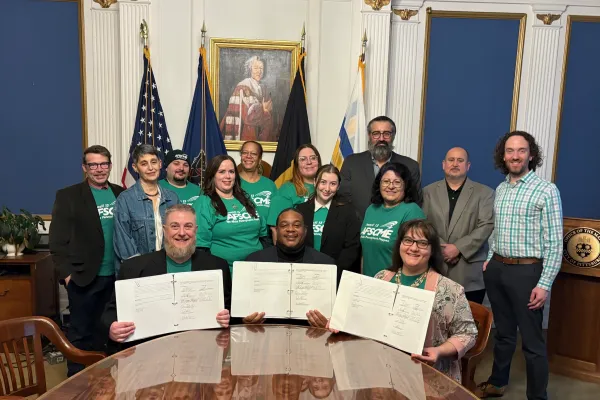 group of afscme members contract signing