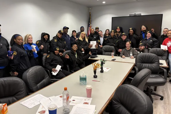 group of workers around a large table